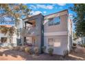 Stylish condo exterior with balconies and a desert landscape, showcasing a modern look at 8600 W Charleston Blvd # 2108, Las Vegas, NV 89117