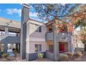 Condo complex exterior featuring muted colors, balconies, and views of surrounding desert landscaping at 8600 W Charleston Blvd # 2108, Las Vegas, NV 89117