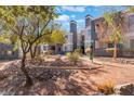 Scenic desert landscaping with trees and foliage surrounding the apartment complex at 8600 W Charleston Blvd # 2108, Las Vegas, NV 89117