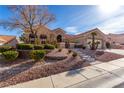 Beautiful single-story home with a well-maintained front yard and neutral color scheme at 10709 Brinkwood Ave, Las Vegas, NV 89134