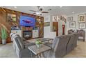 Inviting living room with a cozy fireplace and comfortable seating arrangement at 1223 Casa Palermo Cir, Henderson, NV 89011