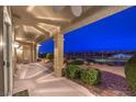 Expansive covered back patio with desert landscaping and picturesque city views at 1964 Oliver Springs St, Henderson, NV 89052