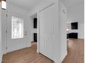 Bright entryway featuring decorative door, wood flooring, and closet at 2058 Citroen St, Las Vegas, NV 89142