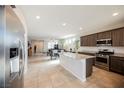 Modern kitchen with stainless steel appliances, an island, and an open layout at 2721 Benton Cove St, Laughlin, NV 89029