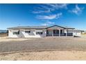 Charming single-story home with awnings and a covered porch, complete with gravel landscaping at 3420 Malibou Ave, Pahrump, NV 89048