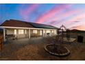 This beautiful backyard features solar panels, a patio, and a charming gazebo, perfect for outdoor living at 3430 Flagstone Ct # 2, Pahrump, NV 89048