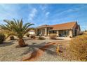Lovely single-story home featuring a low-maintenance xeriscape front yard with gravel and a terracotta tile roof at 3430 Flagstone Ct # 2, Pahrump, NV 89048