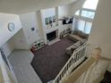 Spacious living room featuring high ceilings, fireplace, large windows, and plush carpeting at 3550 Leor Ct, Las Vegas, NV 89121