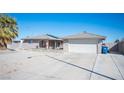 Attractive single-Gathering home with a desert-style front yard, covered porch, and an attached two-car garage at 4746 Rosalie Cir, North Las Vegas, NV 89031