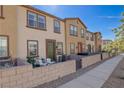 Attractive townhome featuring a private patio, a walkway, and a well-maintained facade at 720 Sleeping City Ave, Henderson, NV 89015