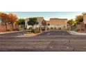 View of community gates with well-manicured landscaping, providing security and curb appeal at 8234 Misty Sage St, Las Vegas, NV 89139