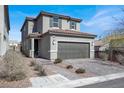 Attractive two-story home with a wide driveway, tile roof, and neat front landscaping at 9330 Brookmont Ave, Las Vegas, NV 89149