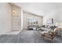 Inviting living room boasts high ceilings, a modern sofa set, and a large window with shutters at 2045 Summit Pointe Dr, Las Vegas, NV 89117