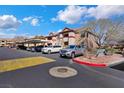 Condominium with assigned parking and landscaped common areas on a sunny day at 231 W Horizon Ridge Pkwy # 527, Henderson, NV 89012