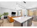 Bright, open-concept living room featuring modern lighting and stylish furnishings at 2536 Catallo St, Henderson, NV 89044
