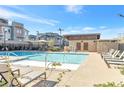 Inviting community pool with lounge chairs and clear blue water, perfect for relaxation at 2536 Catallo St, Henderson, NV 89044