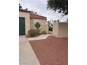 Exterior features a privacy wall, gate, and desert landscaping at 2711 Seabridge Dr, Las Vegas, NV 89121