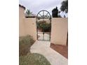 Exterior view through the gate to the backyard of the home at 2711 Seabridge Dr, Las Vegas, NV 89121