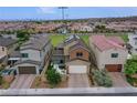 A home equipped with solar panels, it features a covered patio and is situated next to a park at 3066 Casarano Ct, Henderson, NV 89044