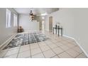 Spacious living room with tile flooring, neutral paint and ceiling fan at 3531 Barrel Bronco Ct, North Las Vegas, NV 89032