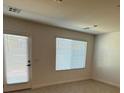 Bright living room with a door to the outside and large windows at 4238 Lemay St # 2, Las Vegas, NV 89115