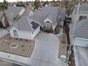 Aerial view of a charming single-story home showcasing the roof, driveway, and landscaping at 6545 Bradford Ln, Las Vegas, NV 89108