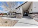 Stunning close up of a front porch with stone accents and modern lighting at 6917 Leon Ave, Las Vegas, NV 89131