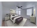 Serene main bedroom featuring a plush bed, neutral tones, a ceiling fan, and ample natural light at 840 Sheerwater Ave, Henderson, NV 89052