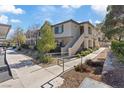 Charming two-story condo featuring a landscaped walkway and inviting outdoor space at 10225 King Henry Ave # 102, Las Vegas, NV 89144