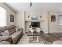 Comfortable living room featuring a cozy sofa, elegant decor, and modern entertainment center at 10655 Tray Mountain Ave, Las Vegas, NV 89166
