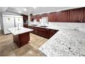 Spacious kitchen featuring granite countertops and dark wood cabinets at 2324 E Oakey Blvd, Las Vegas, NV 89104