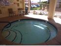 Community hot tub area with a table and chairs, perfect for relaxation at 3781 Desert Marina Dr # 101, Laughlin, NV 89029