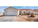 Cozy one-story home with a two-car garage and low maintenance landscaping at 4142 Forestville St, North Las Vegas, NV 89032