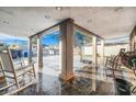 Inviting outdoor living space with tile flooring and covered seating area at 5162 Woodruff Pl, Las Vegas, NV 89120