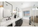 Stylish bathroom featuring a double vanity, soaking tub, glass shower, and contemporary fixtures at 5904 Willowcreek Rd, North Las Vegas, NV 89031