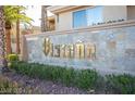 Elegant stone sign displaying the community's name, surrounded by lush greenery at 7115 S Durango Dr # 313, Las Vegas, NV 89113