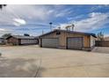 View of the home's exterior featuring a spacious driveway and a two-car garage at 723 Spanish Dr, Las Vegas, NV 89110