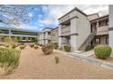 Building exterior showcasing stairs, landscaping, and attractive architectural design at 7255 W Sunset Rd # 1103, Las Vegas, NV 89113