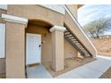 Close-up view of the front entrance showing the unit number, secure door, and convenient stair access at 833 Aspen Peak Loop # 712, Henderson, NV 89011