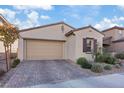 Charming single-story home with a brick driveway and manicured landscaping at 8876 Trotternish Ridge Dr, Las Vegas, NV 89166