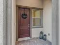 Inviting front door with a 'Welcome' wreath and decorative lanterns at 8876 Trotternish Ridge Dr, Las Vegas, NV 89166