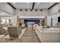 Open living room flows to a covered patio with a fire pit and city views at 10096 Amethyst Hills St, Las Vegas, NV 89148