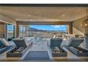 Inviting outdoor patio offers a serene retreat with lounge chairs, a water feature, and a built-in barbecue at 10096 Amethyst Hills St, Las Vegas, NV 89148