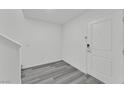 Clean entryway featuring plank flooring and a white front door at 12305 Crimson Horizon Rd # 4, Las Vegas, NV 89183
