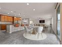 Open-concept kitchen, dining, and living area with modern finishes and ample natural light at 201 White Mule Ave, Las Vegas, NV 89148