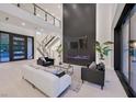 Spacious living room features a linear fireplace, soaring ceilings, and ample natural light at 34 Vintage Canyon St, Las Vegas, NV 89141