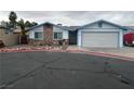 Charming single-story home featuring desert landscaping and a two-car garage at 4712 Primavera St, Las Vegas, NV 89122