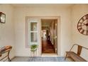 Inviting front porch with neutral decor and an open view into the house through the door at 5453 Brass Hills Ct, Las Vegas, NV 89122