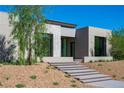 Stylish contemporary home featuring clean lines, desert landscaping, and a welcoming entrance at 6 Rockmount Ct, Henderson, NV 89012