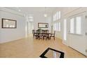Inviting dining room with plantation shutters and elegant tile flooring at 6120 Farm Rd, Las Vegas, NV 89131
